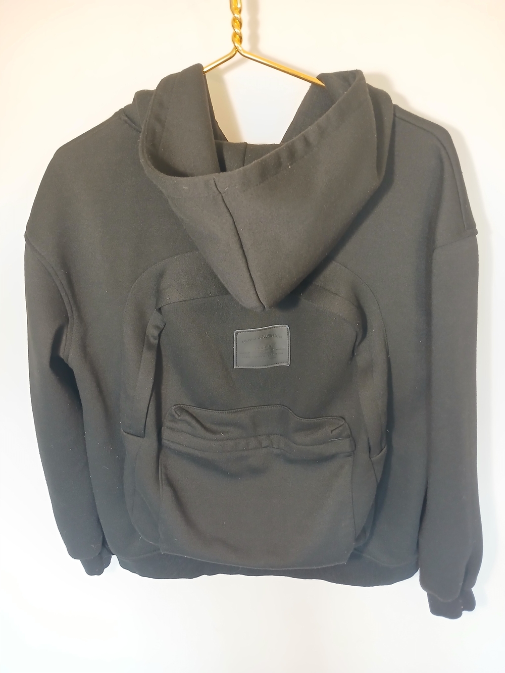 Black Hooded Jacket with Integrated Backpack Pocket